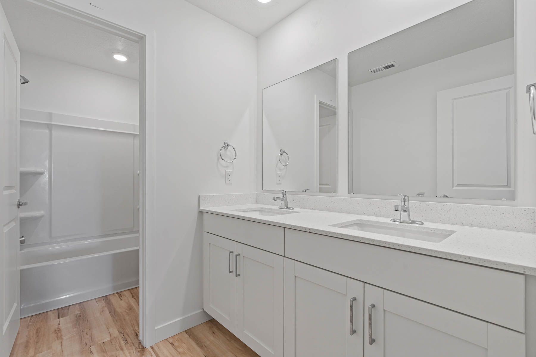 The secondary bathroom has a sprawling vanity.