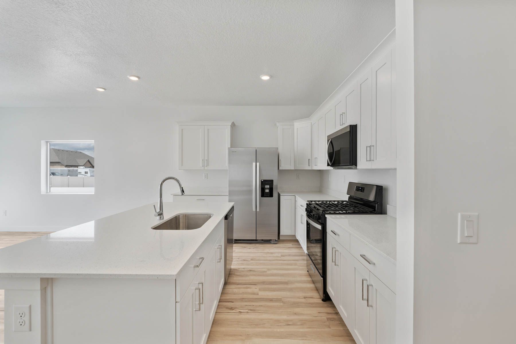 The kitchen has stainless steel, energy efficient appliances.