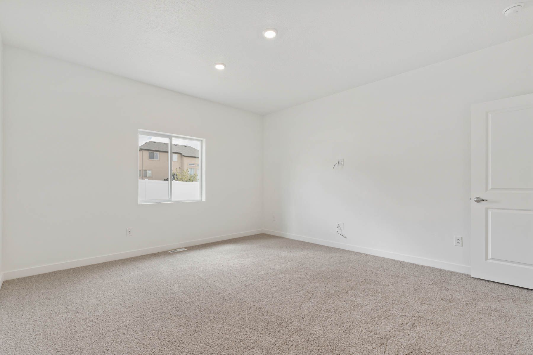 The master bedroom has a large window that lets in great, natural light. 