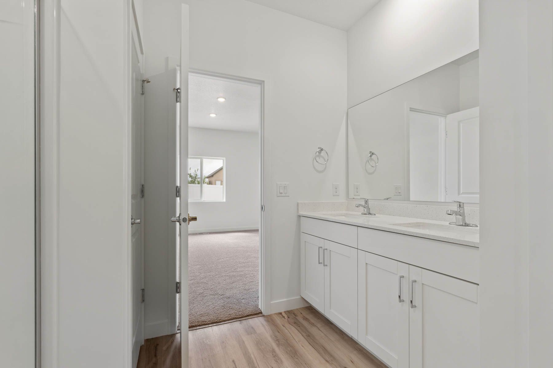The master bathroom has a sprawling vanity.