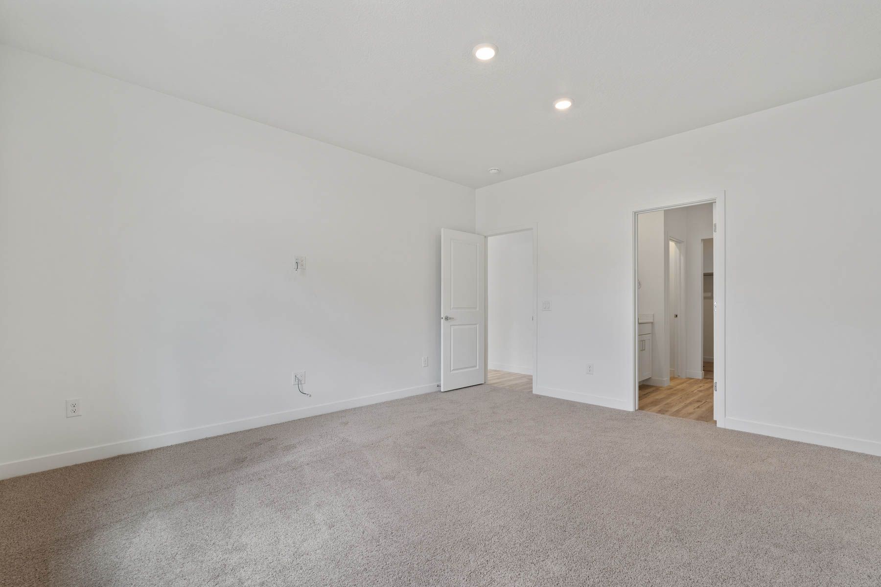 The master suite has a large bedroom, ensuite bathroom and a walk-in closet.