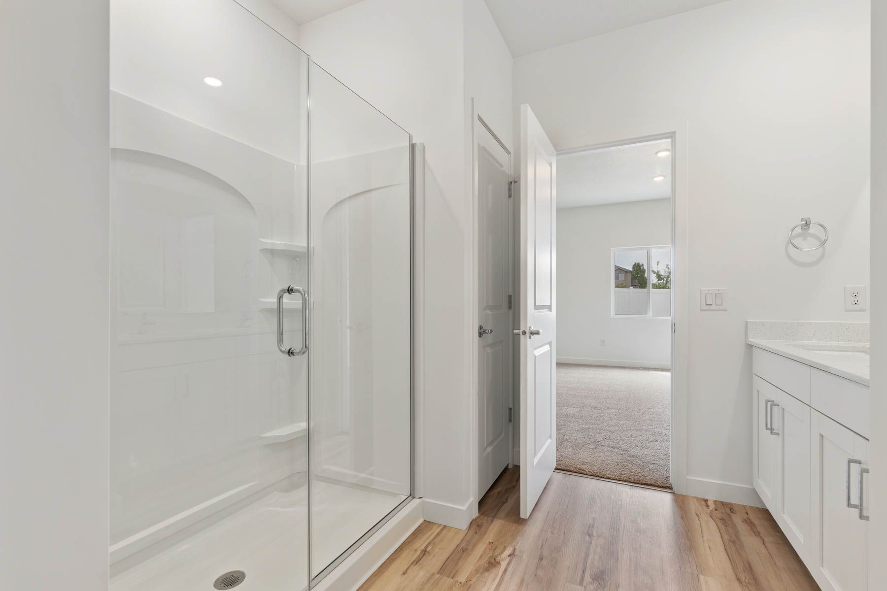 The master bathroom has a glass, walk-in shower.