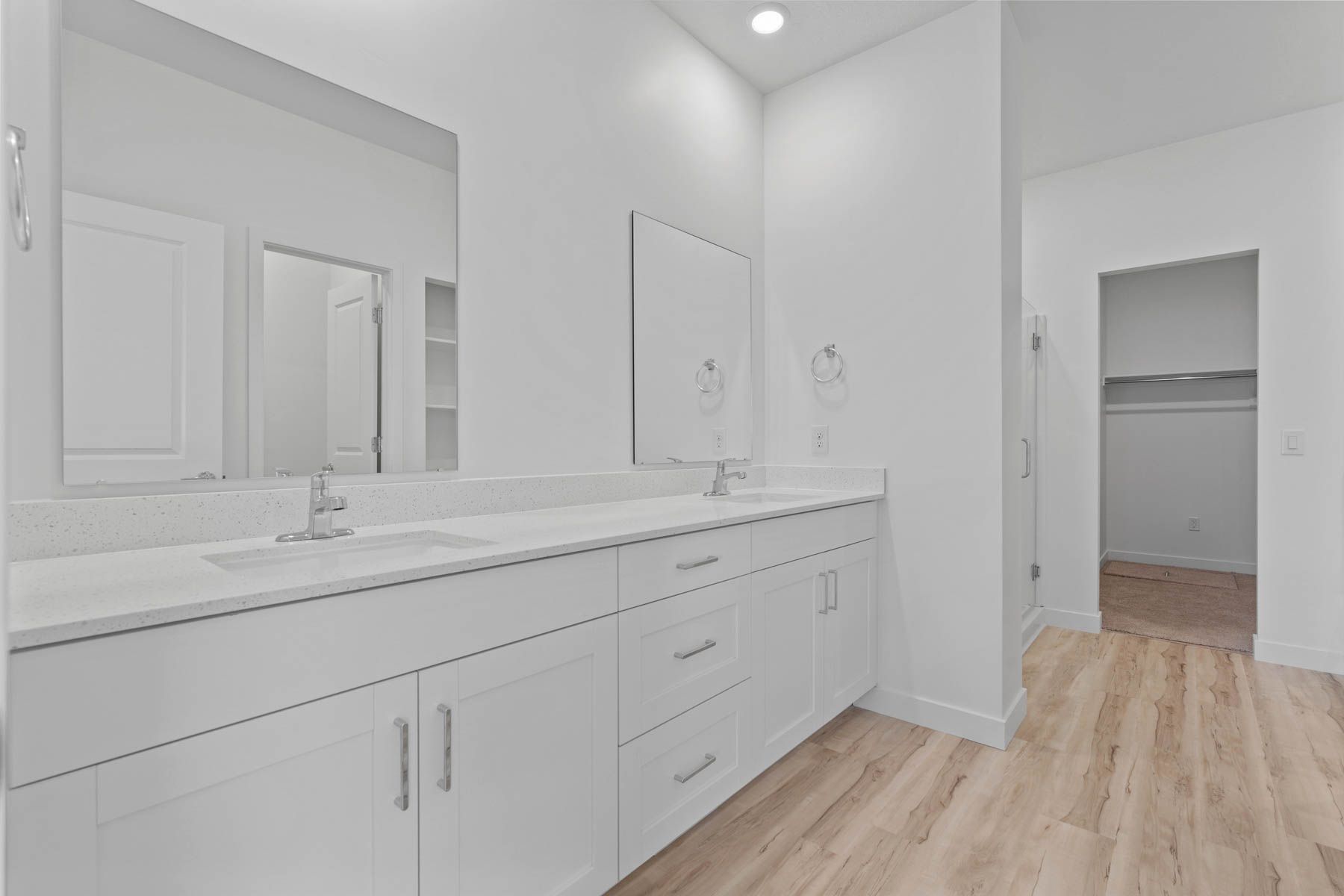 The master bathroom has a sprawling dual-sink vanity.