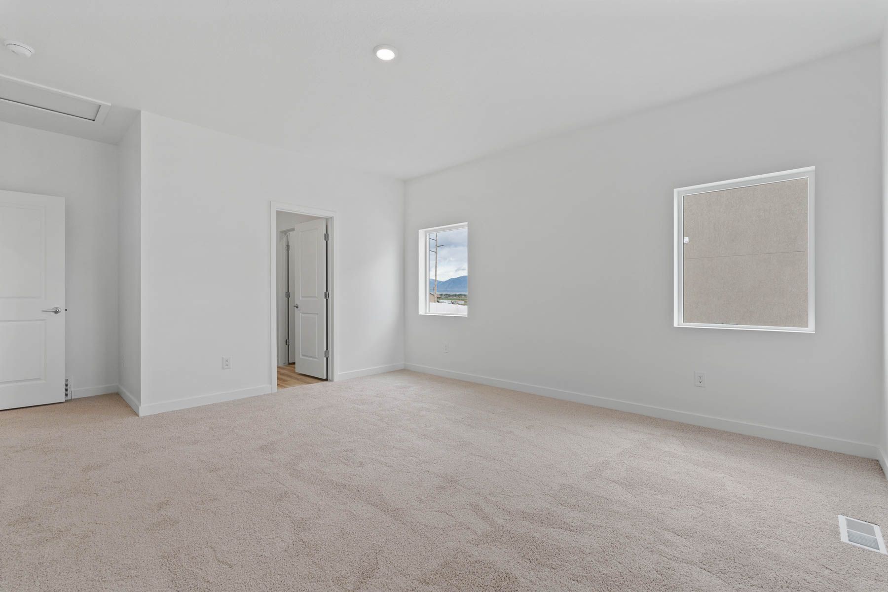 The master suite has a large bedroom, ensuite bathroom and a walk-in closet.
