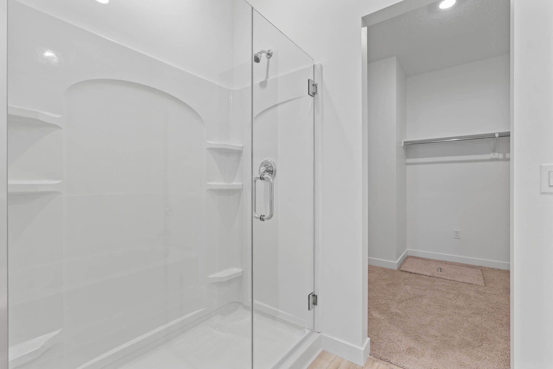 The master bathroom has a glass, walk-in shower.