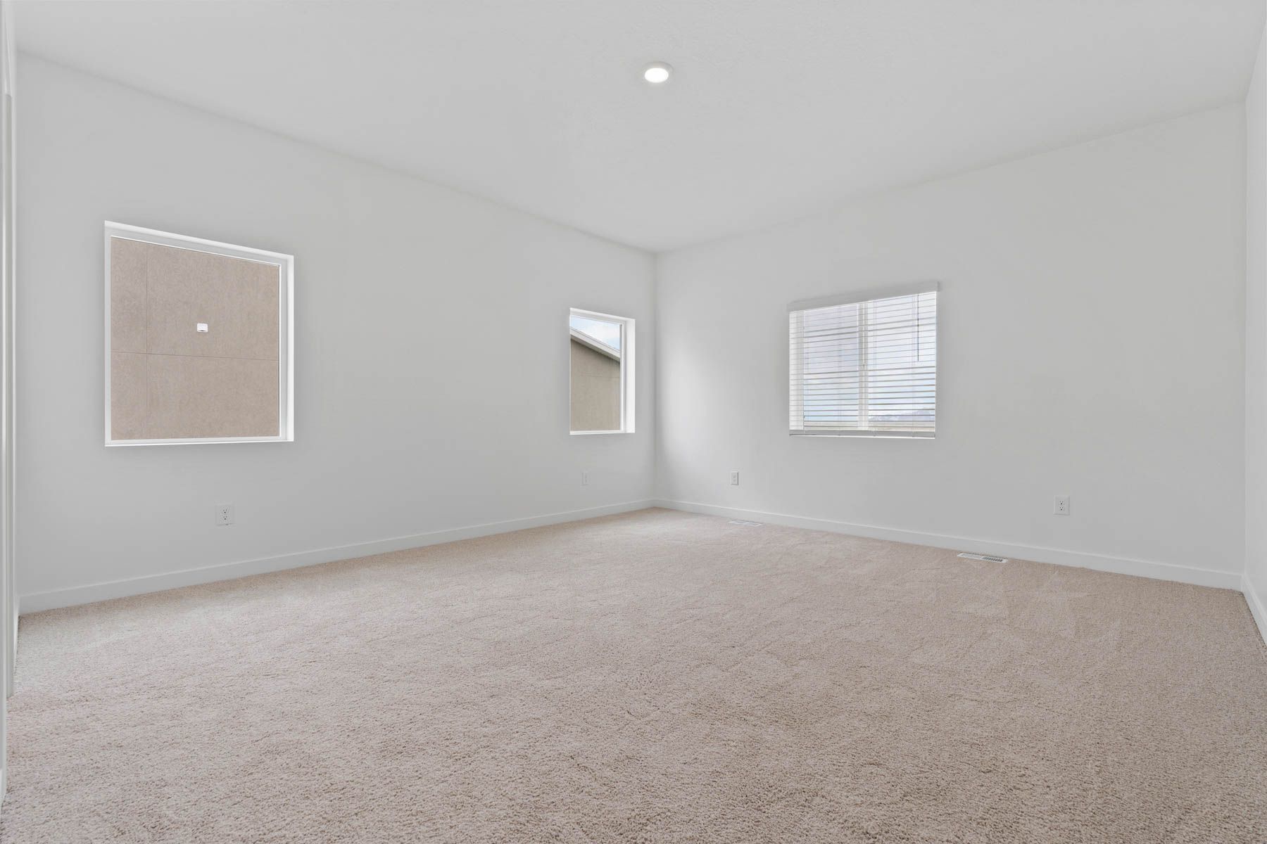 The master bedroom has a large window that lets in great, natural light. 