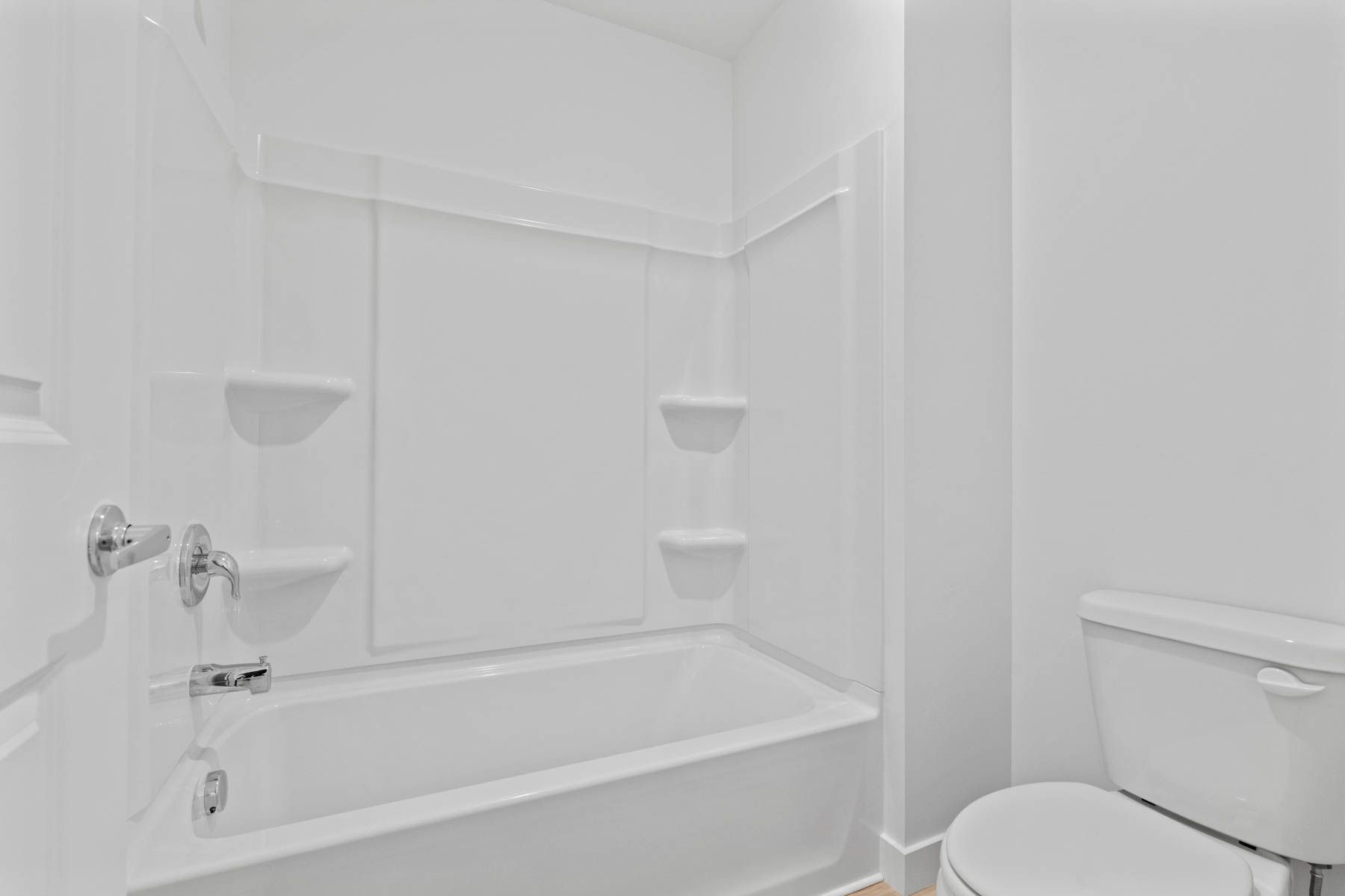 The secondary bathroom has a shower-tub combo.
