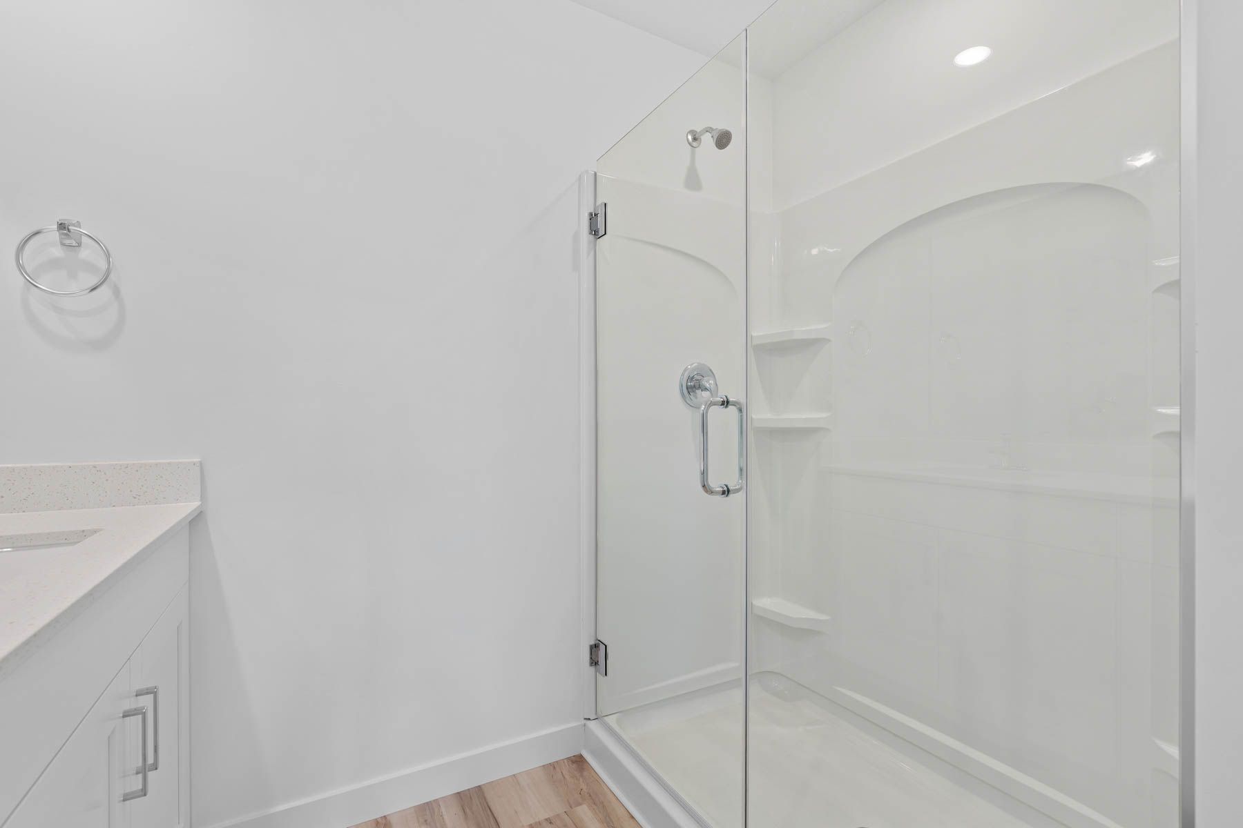 The master bathroom has a glass, walk-in shower.