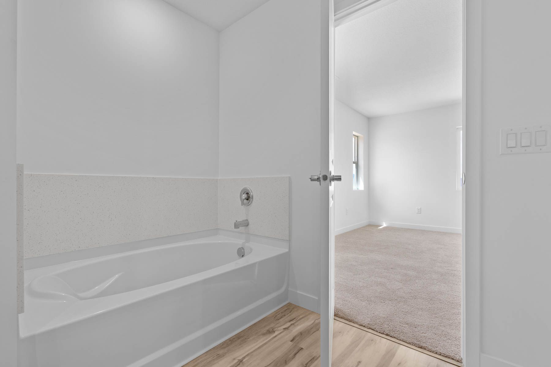 The master bathroom has a garden tub. 