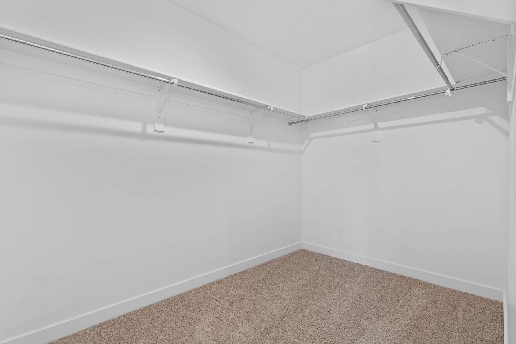 The walk-in closet is the perfect place to store clothes, shoes, and other personal belongings. 