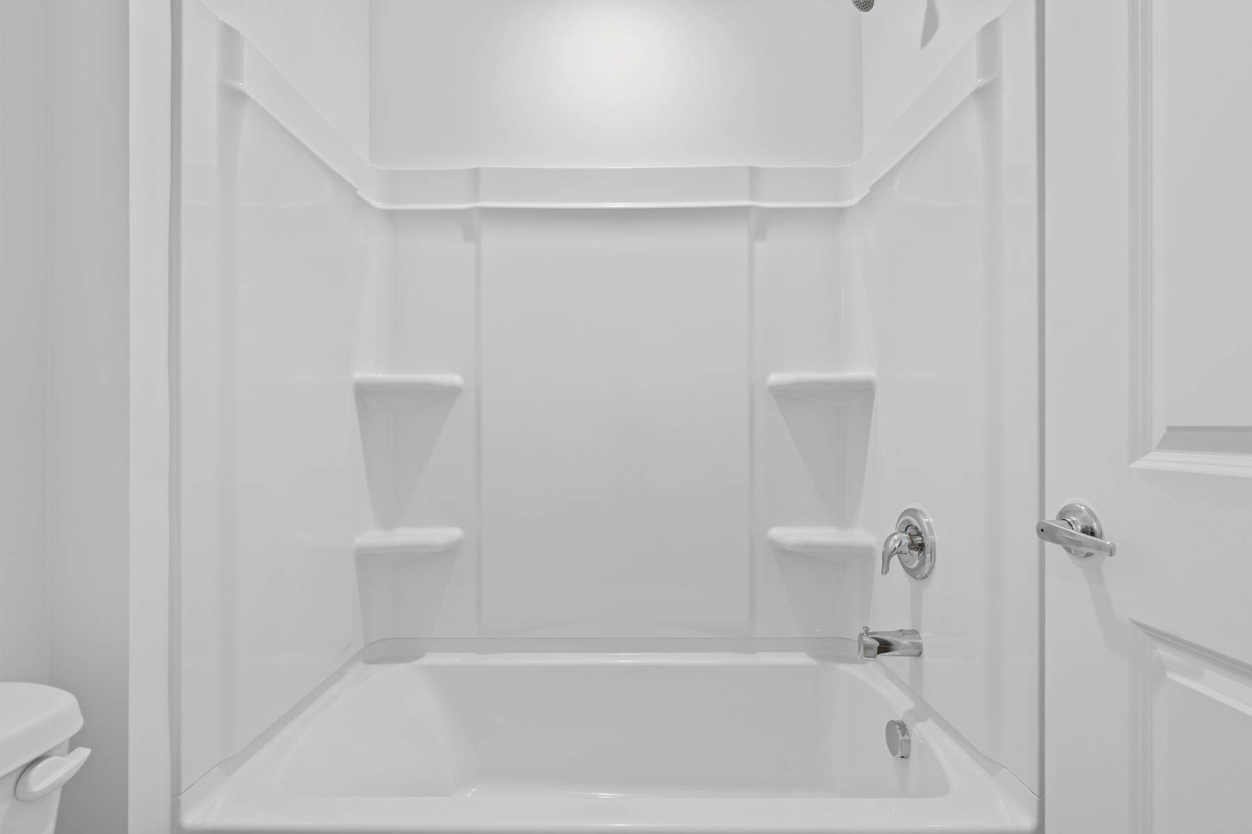 The secondary bathroom has a shower-tub combo.