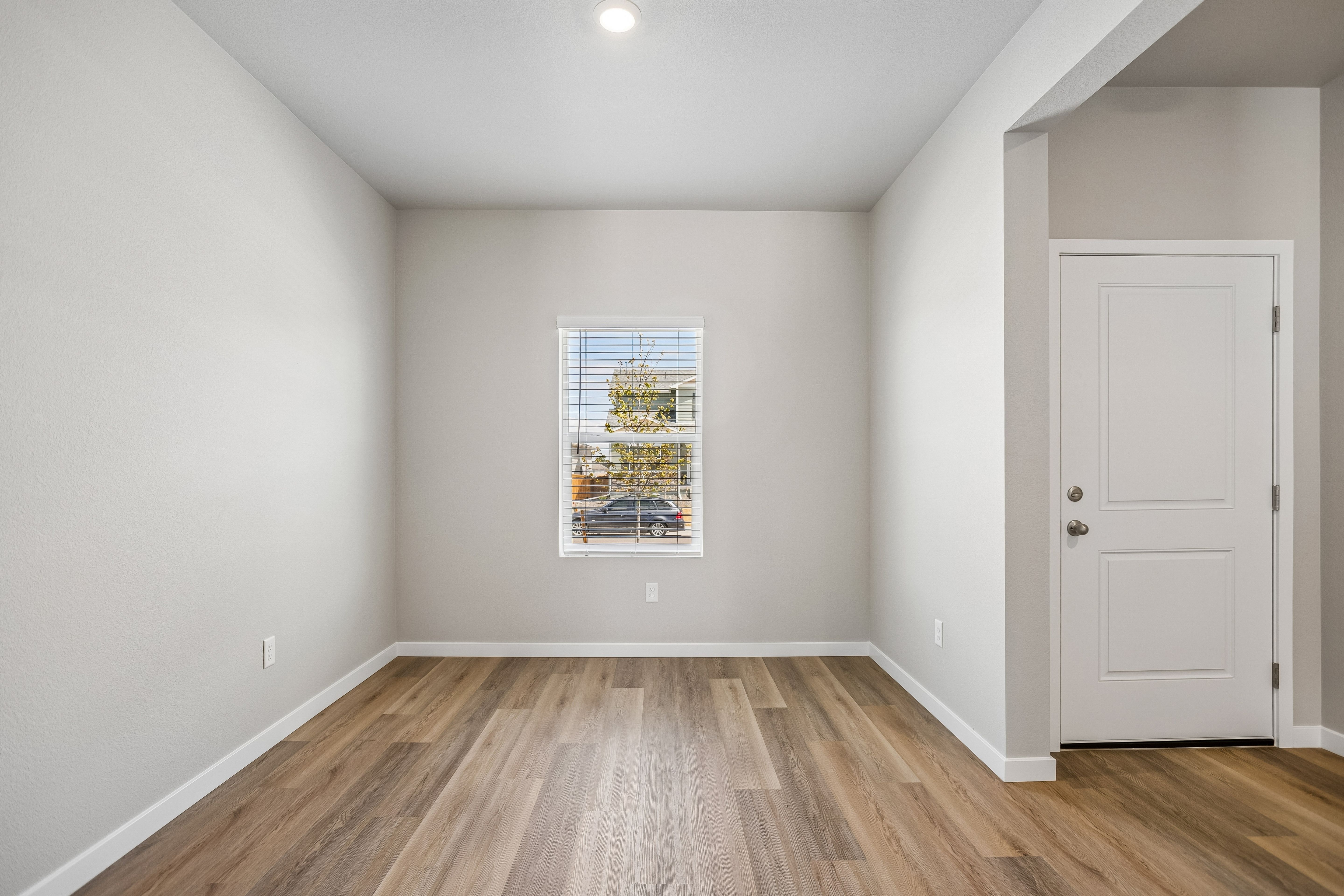 There is a dining room in the front of the home off the kitchen.
