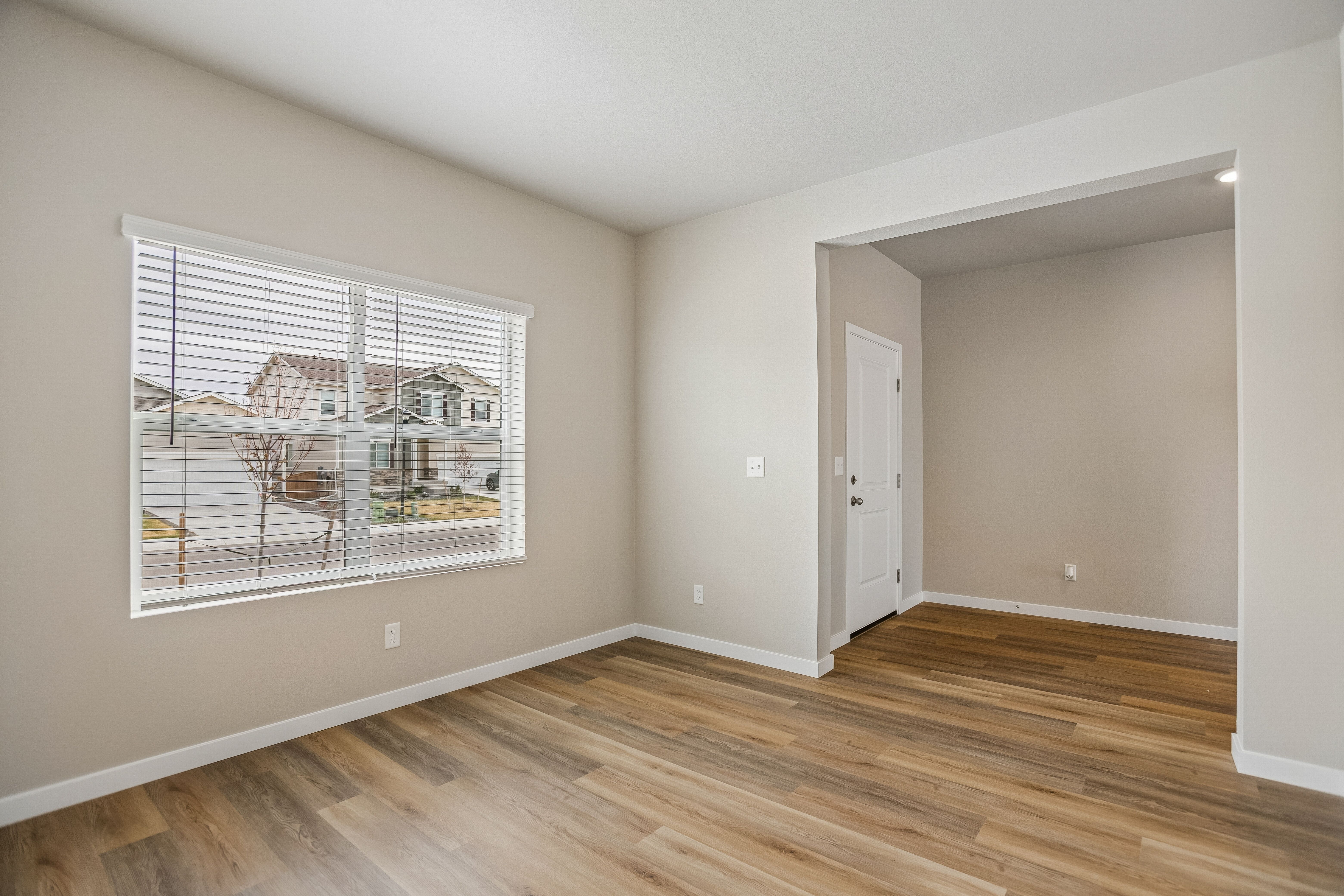 There is a dining room in the front of the home off the kitchen.