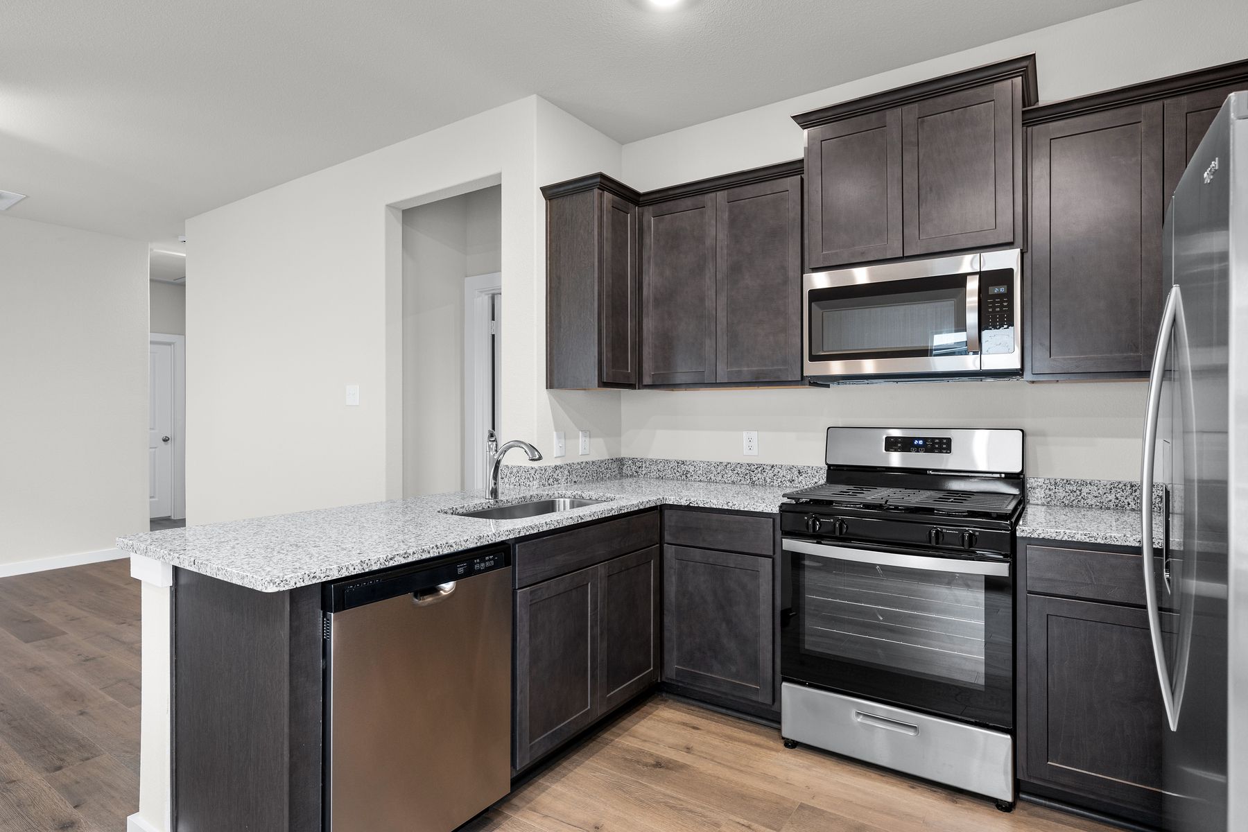 The kitchen has sprawling granite countertops.