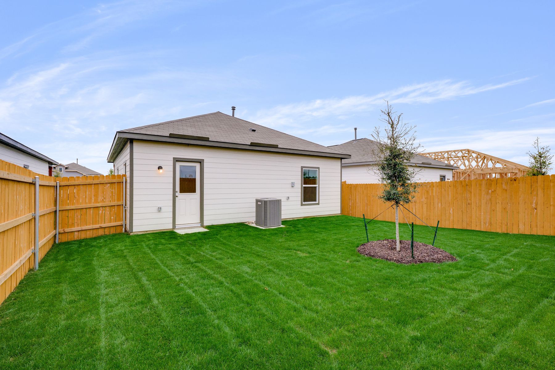 The back yard of the Atticus is fully fenced-in.