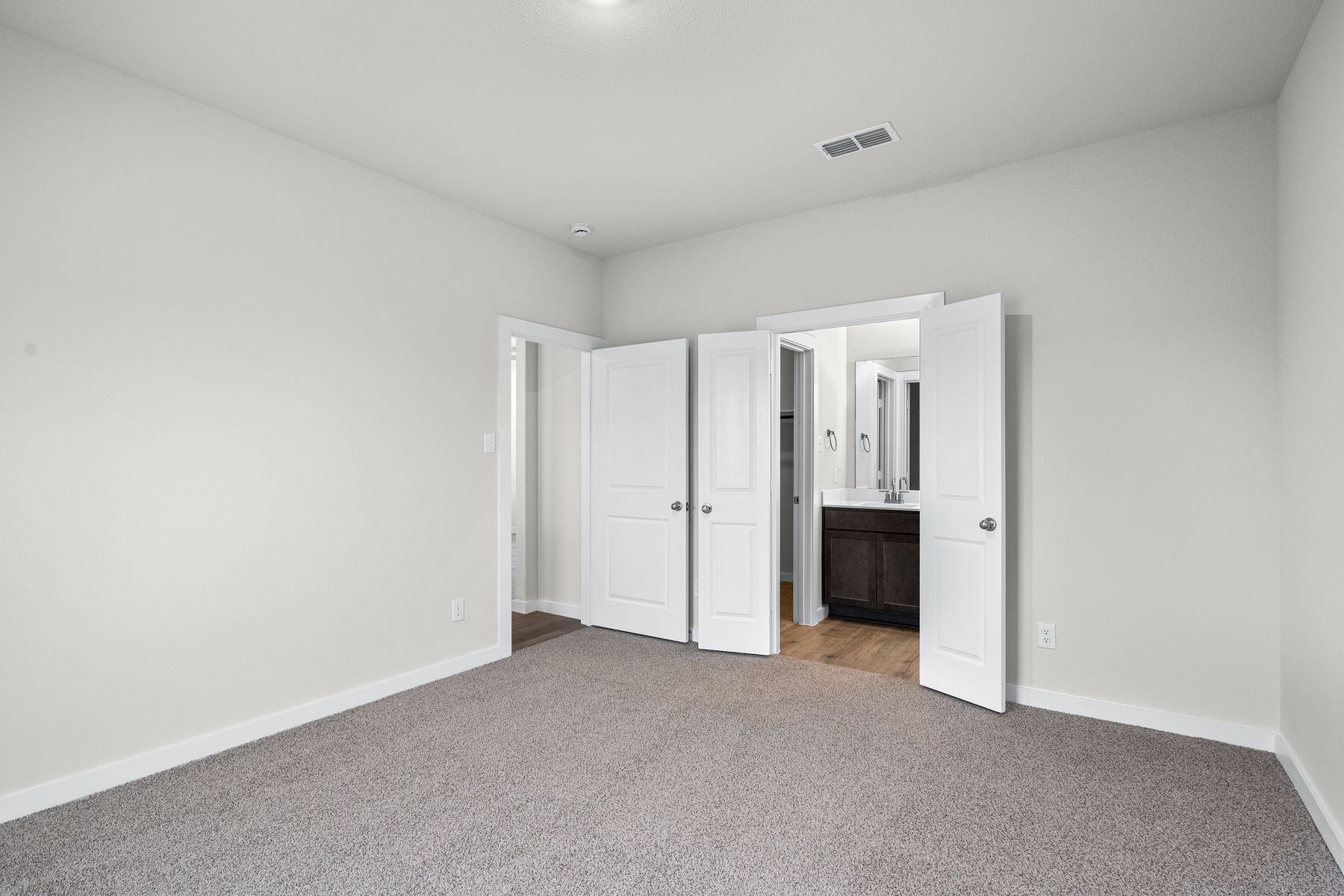 The master suite has a large bedroom, ensuite bathroom and a walk-in closet. 