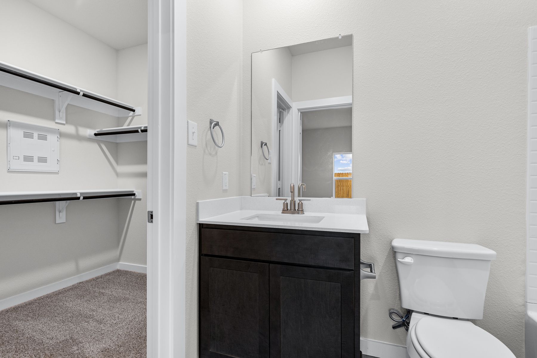 The master walk-in closet is located off of the bathroom.