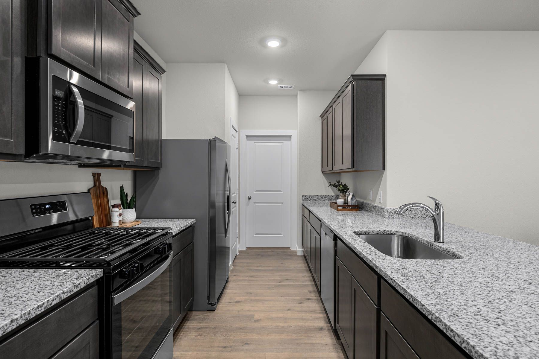 The kitchen has sprawling granite countertops.