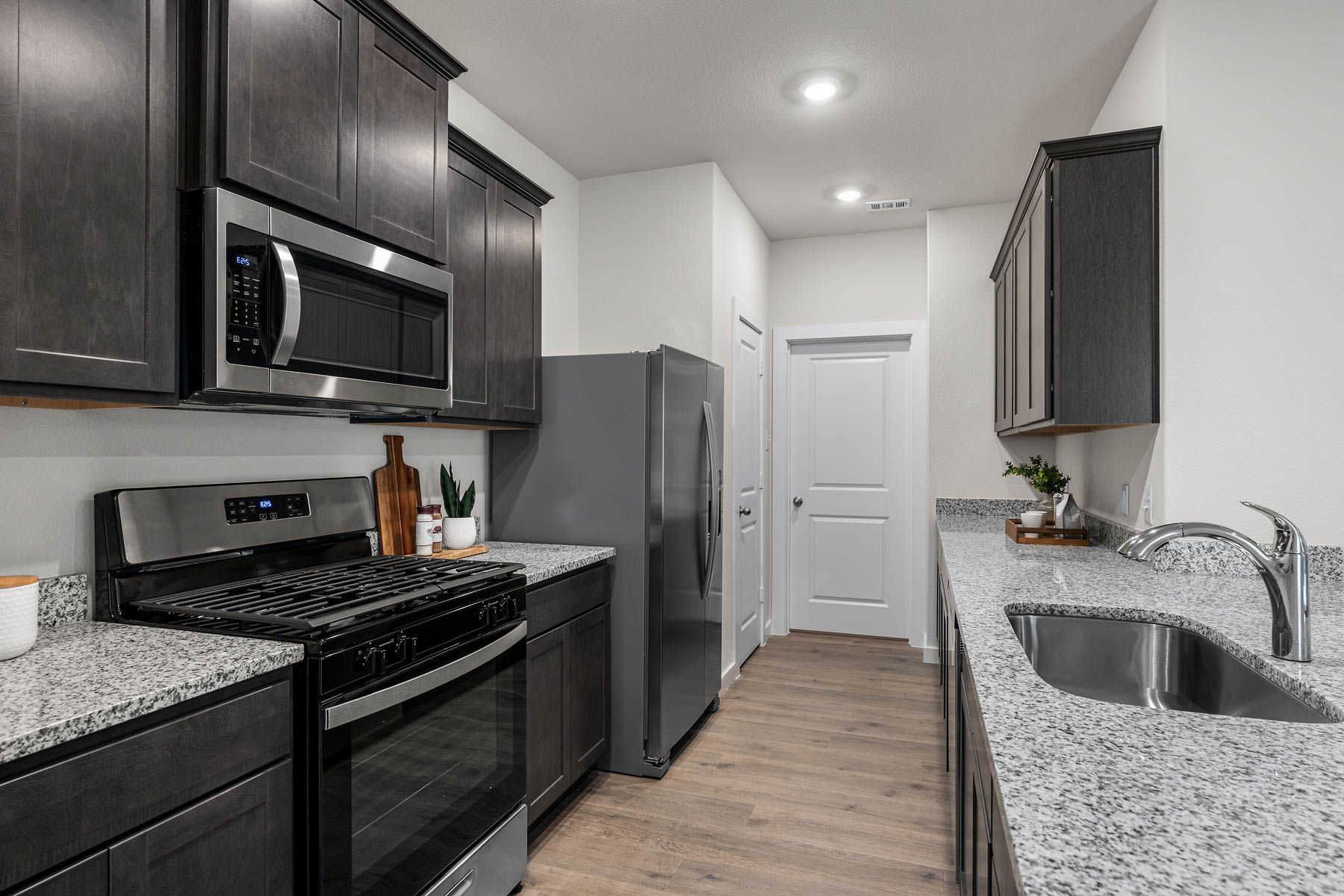 The kitchen has beautiful wood cabinetry.