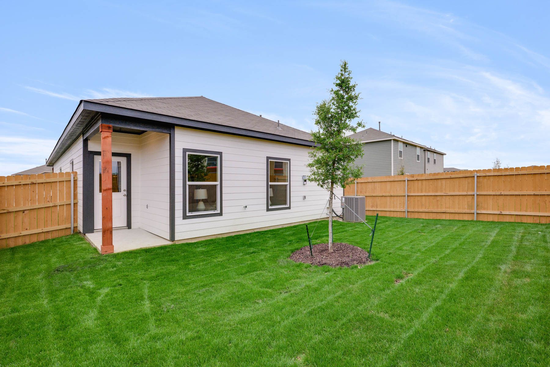 The back yard of the Cedar is fully fenced-in.
