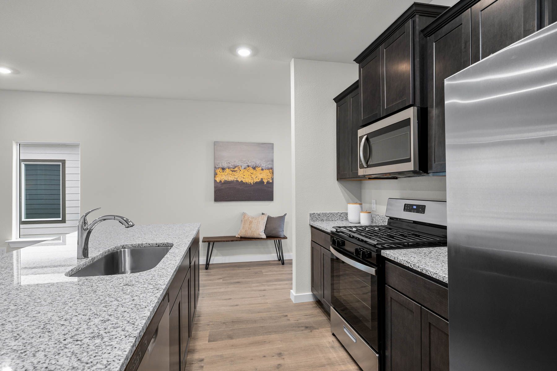 The kitchen has a deep sink and Moen faucet. 