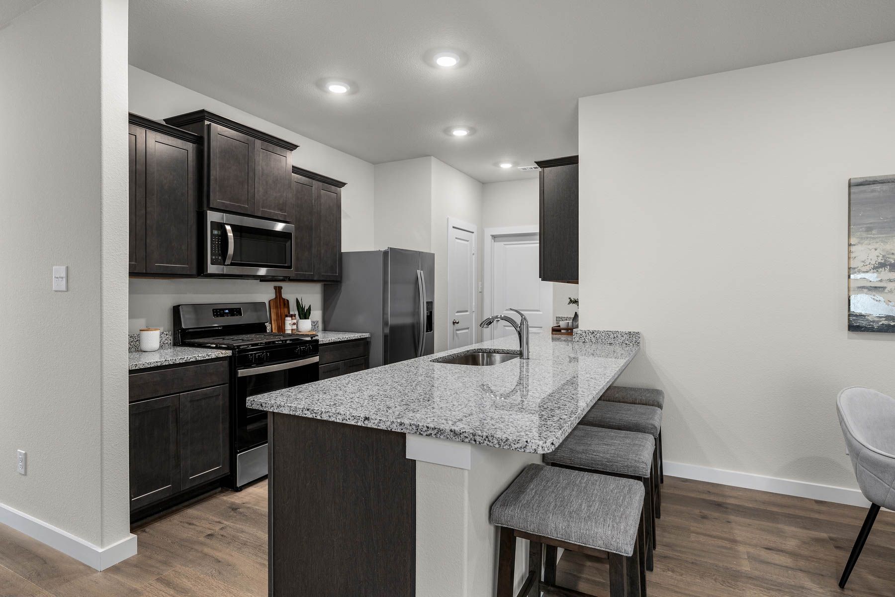 The kitchen has a wonderful breakfast bar. 
