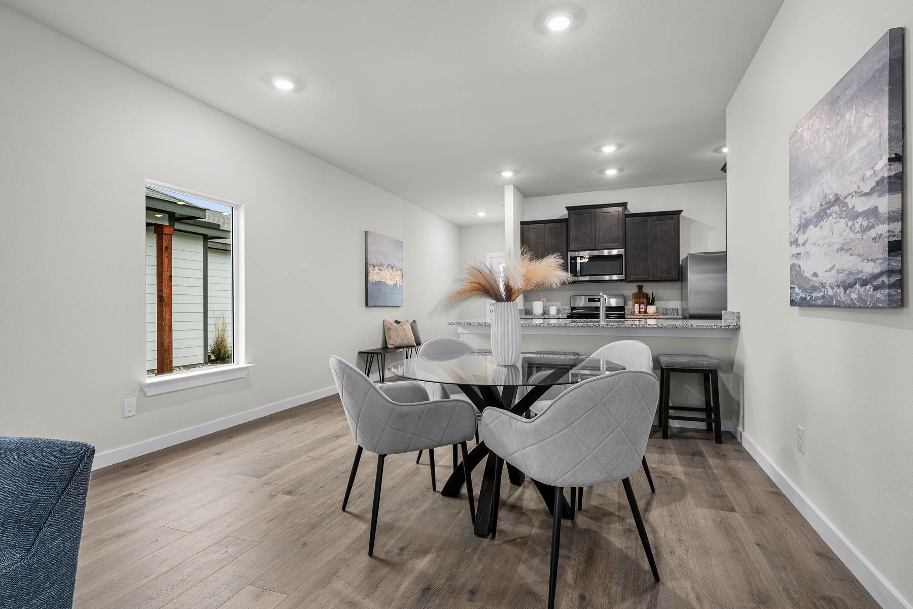 The dining room has a large window that lets in great, natural light. 