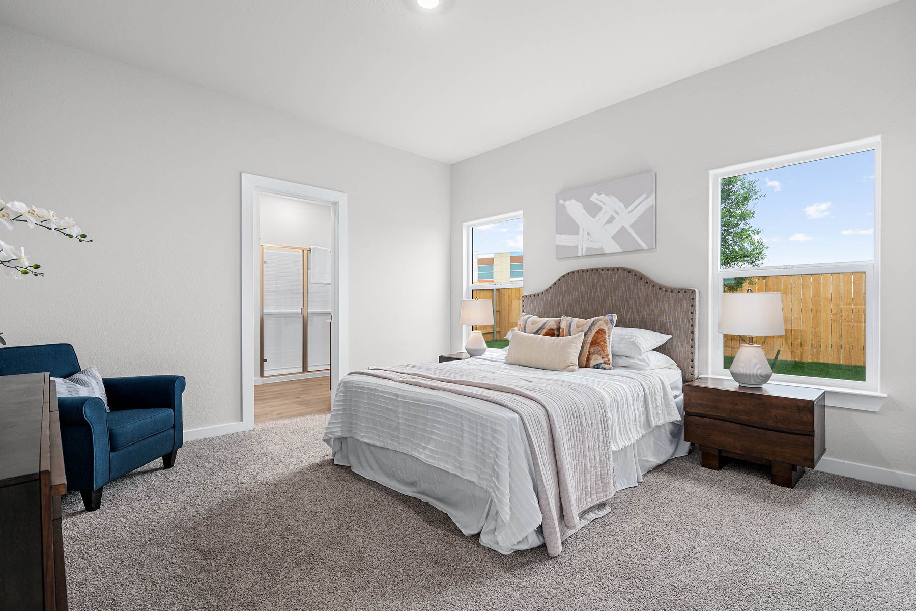 The master bedroom is spacious and has a large window.