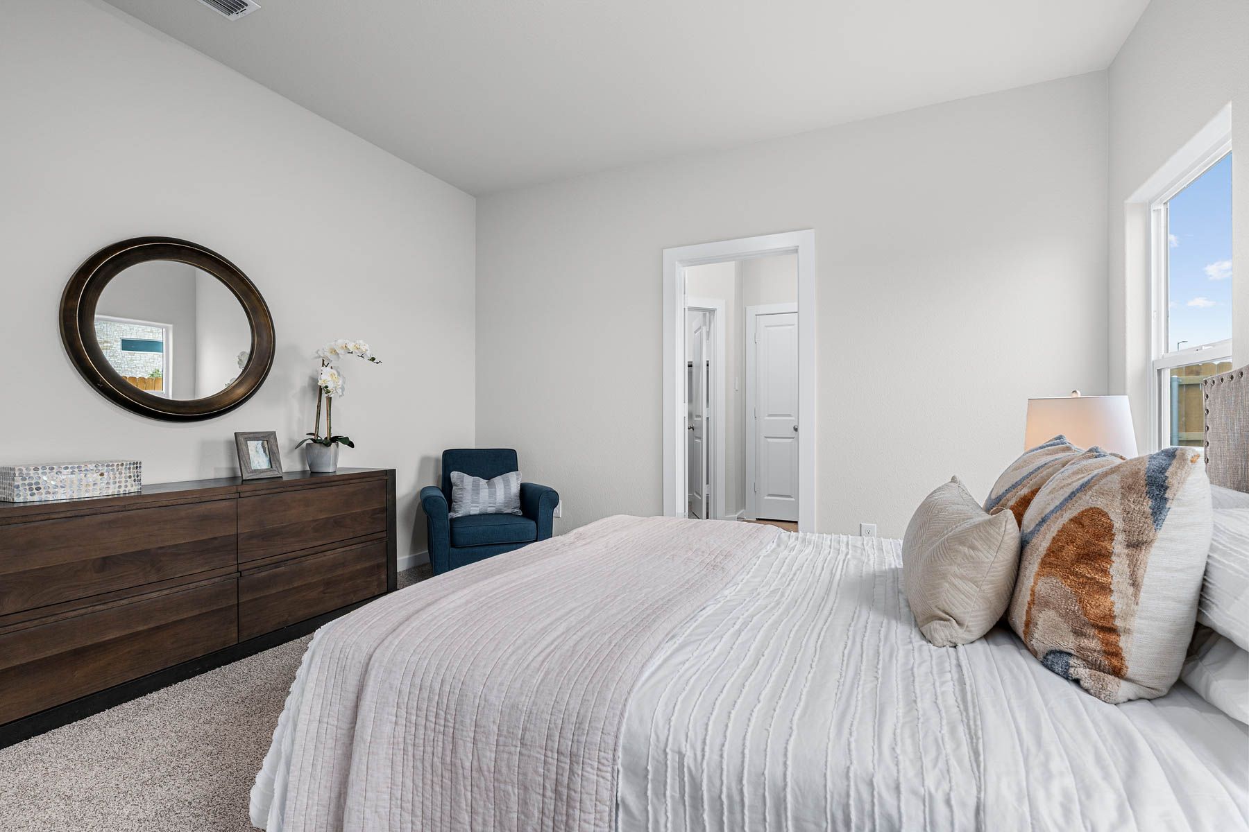 The master suite has a large bedroom, ensuite bathroom and a walk-in closet. 