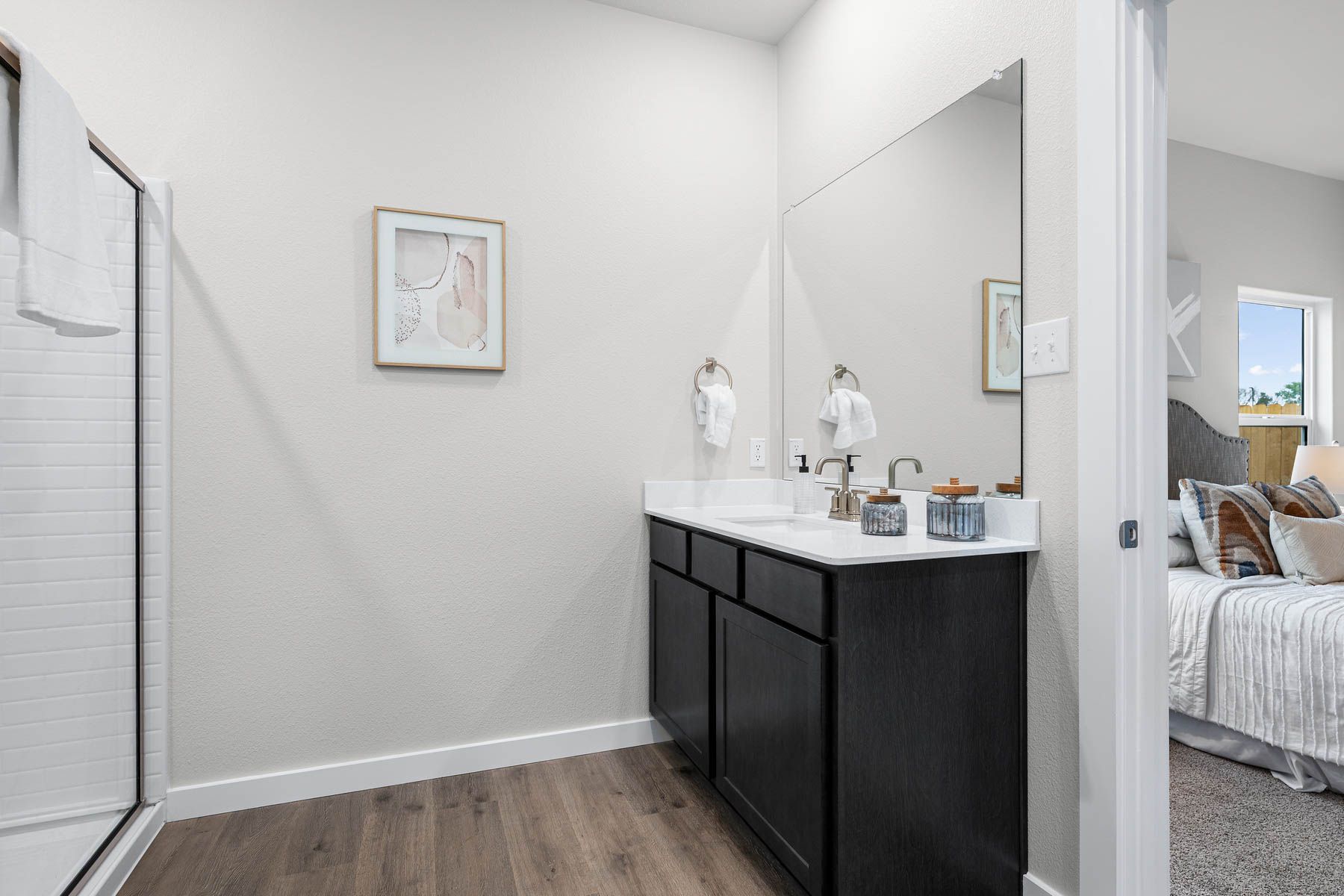 The master bathroom has a sprawling vanity.