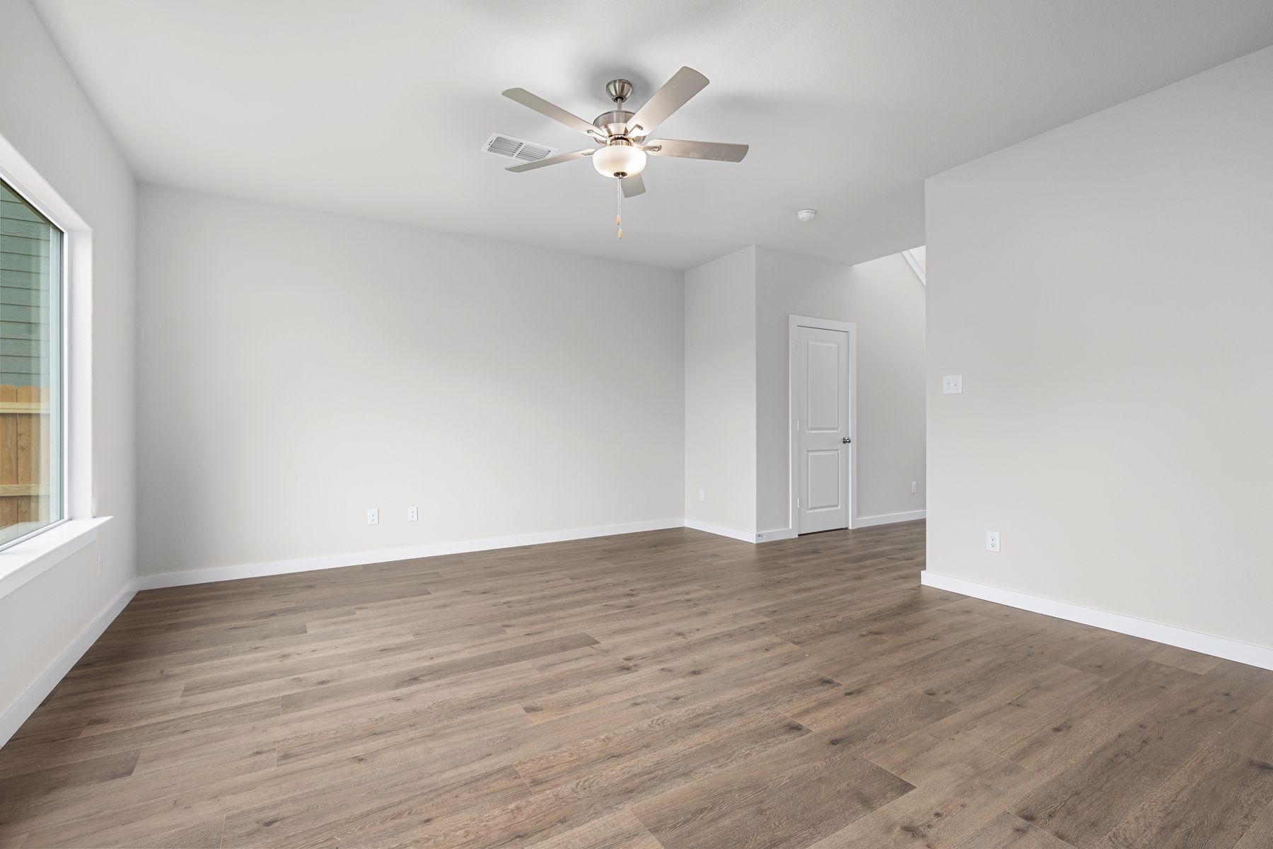 The family room is spacious and has plenty of room for furniture.