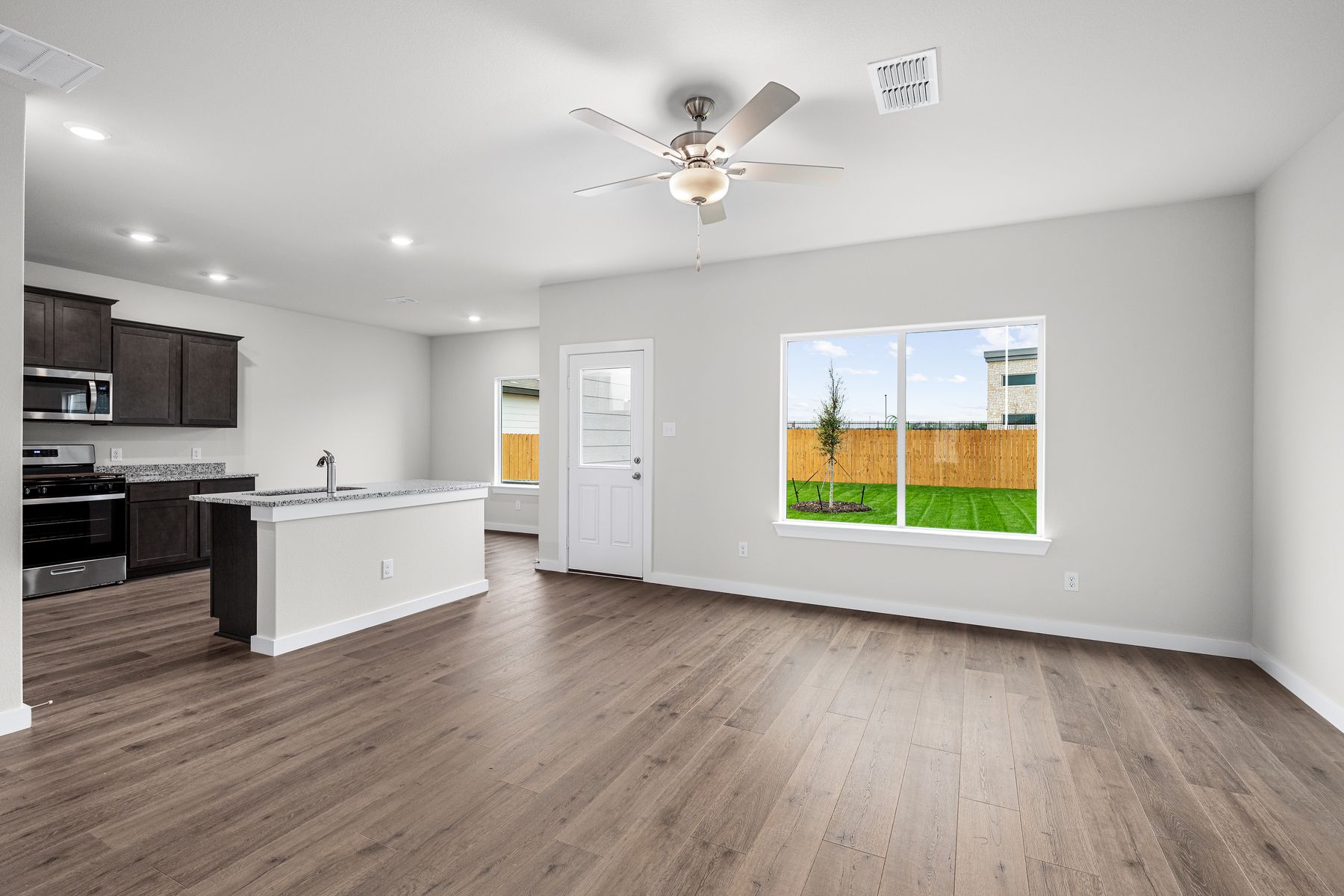 The kitchen has sprawling granite countertops.