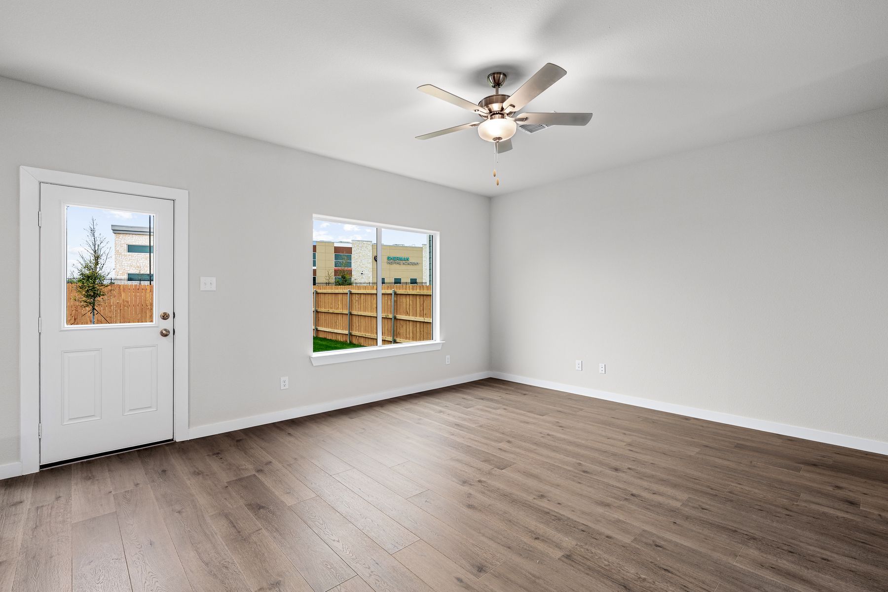 The family room has a large window that lets in great, natural light.