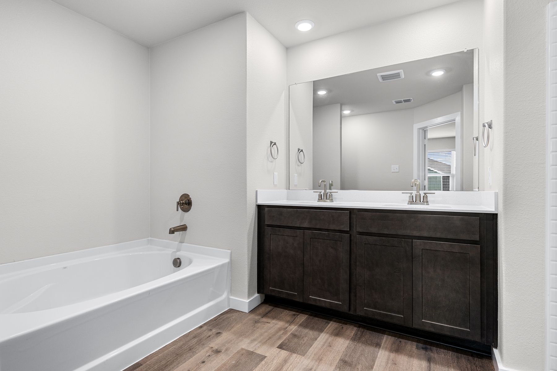 The master bathroom has a garden tub.