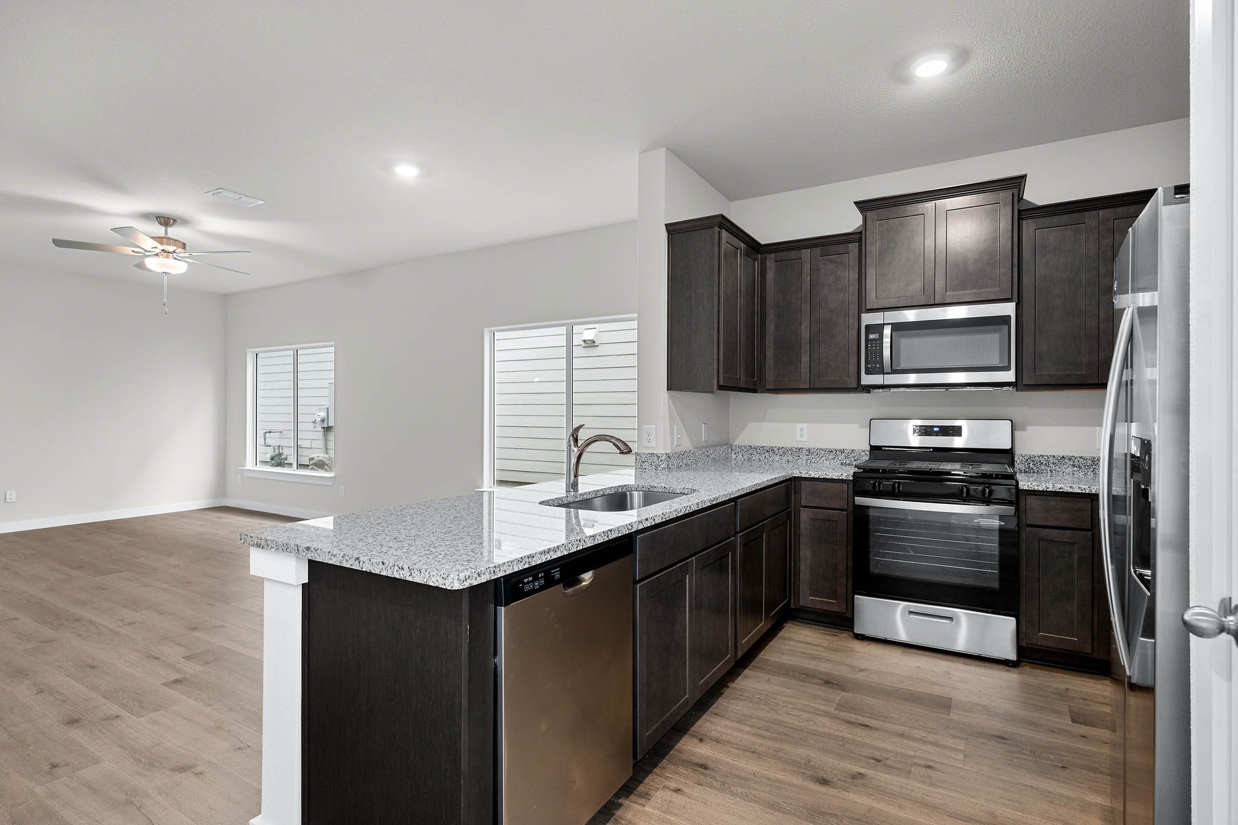 The kitchen has sprawling granite countertops.