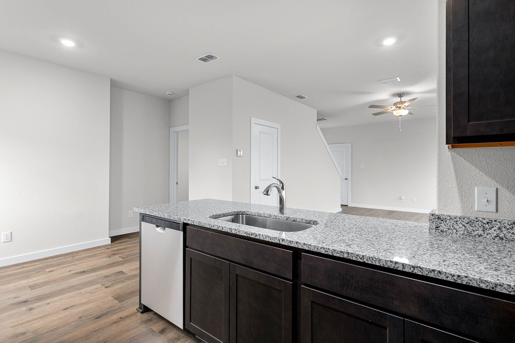 The kitchen looks out at the large living room.