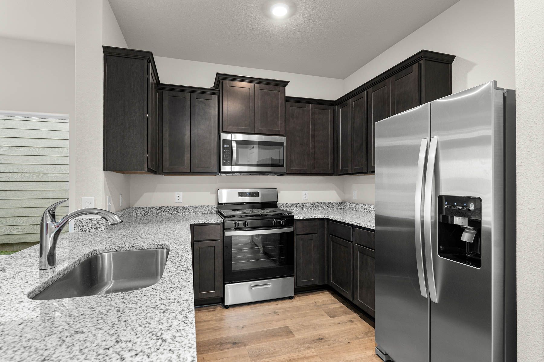 The kitchen has beautiful wood cabinetry.