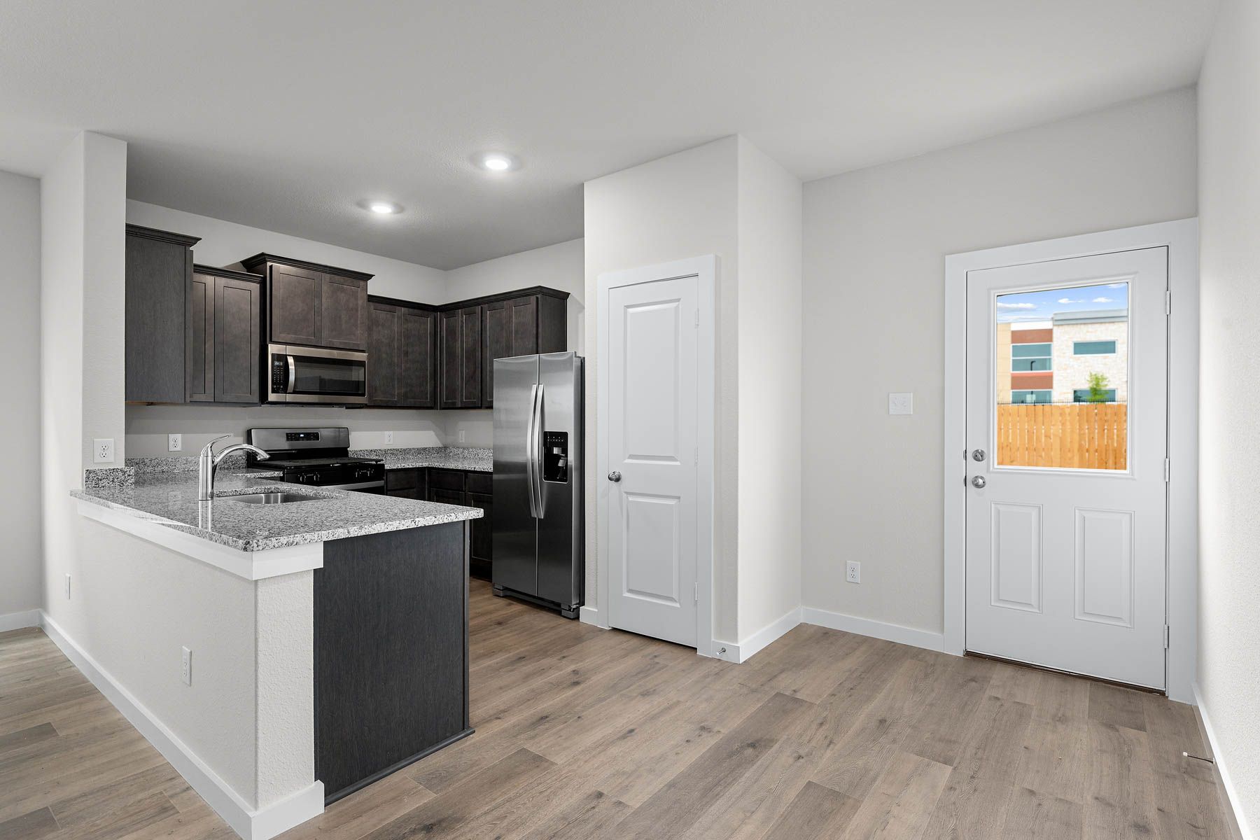 The dining room has a large window that lets in great, natural light. 