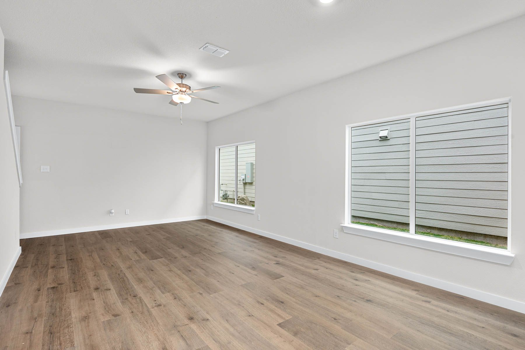 The family room is spacious and has plenty of room for furniture.