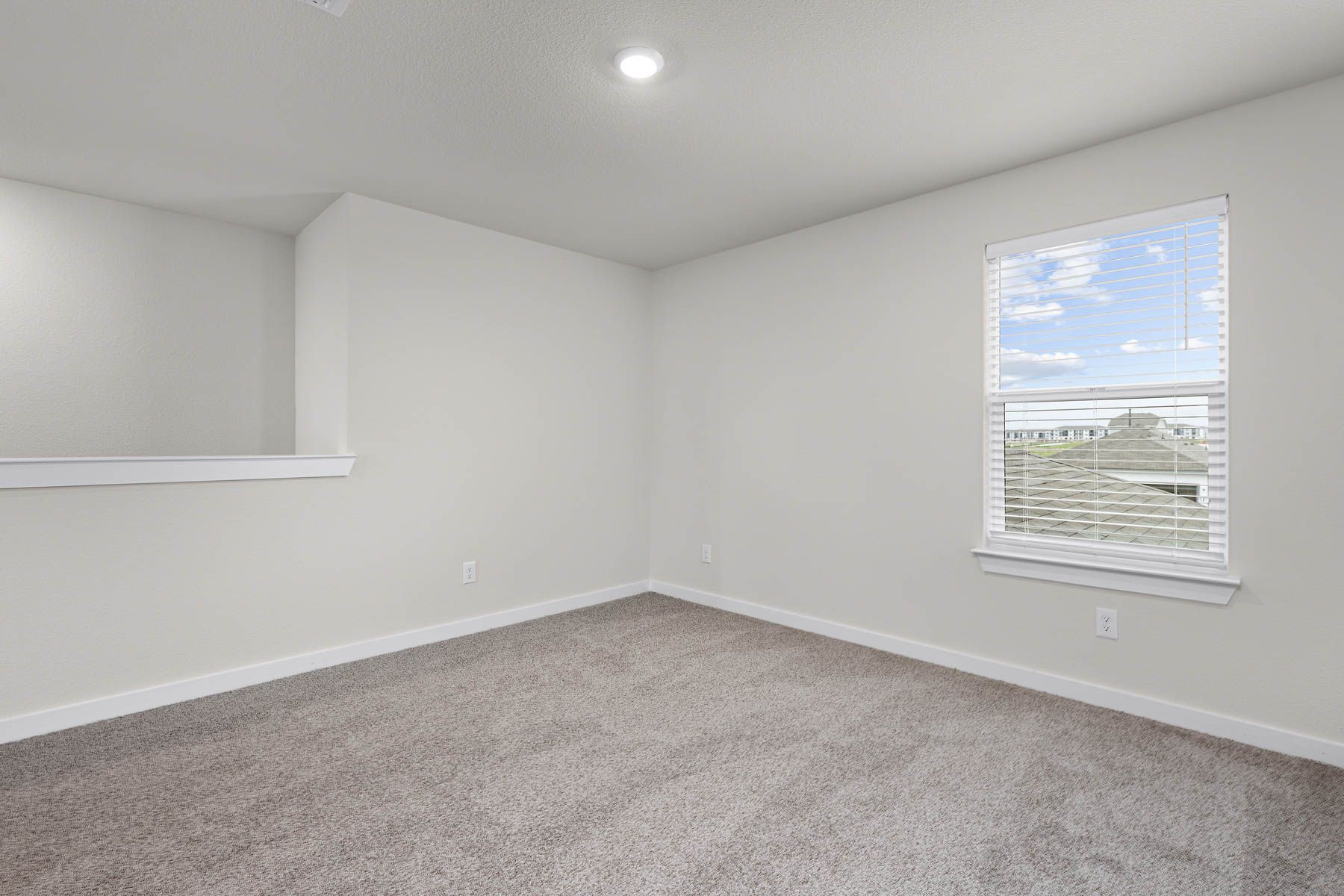 Upstairs, the spacious loft is a versatile space.