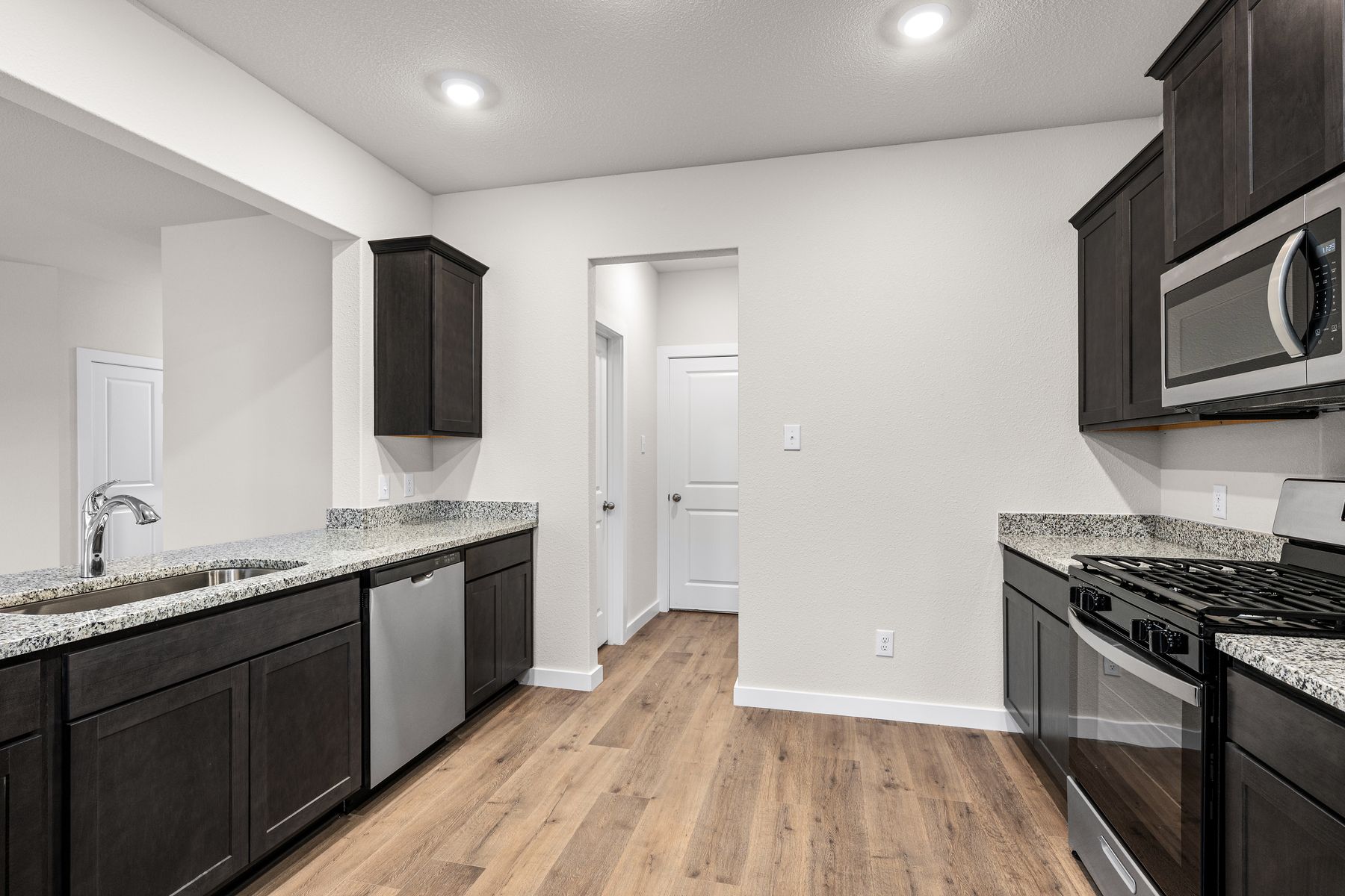The kitchen has sprawling granite countertops.