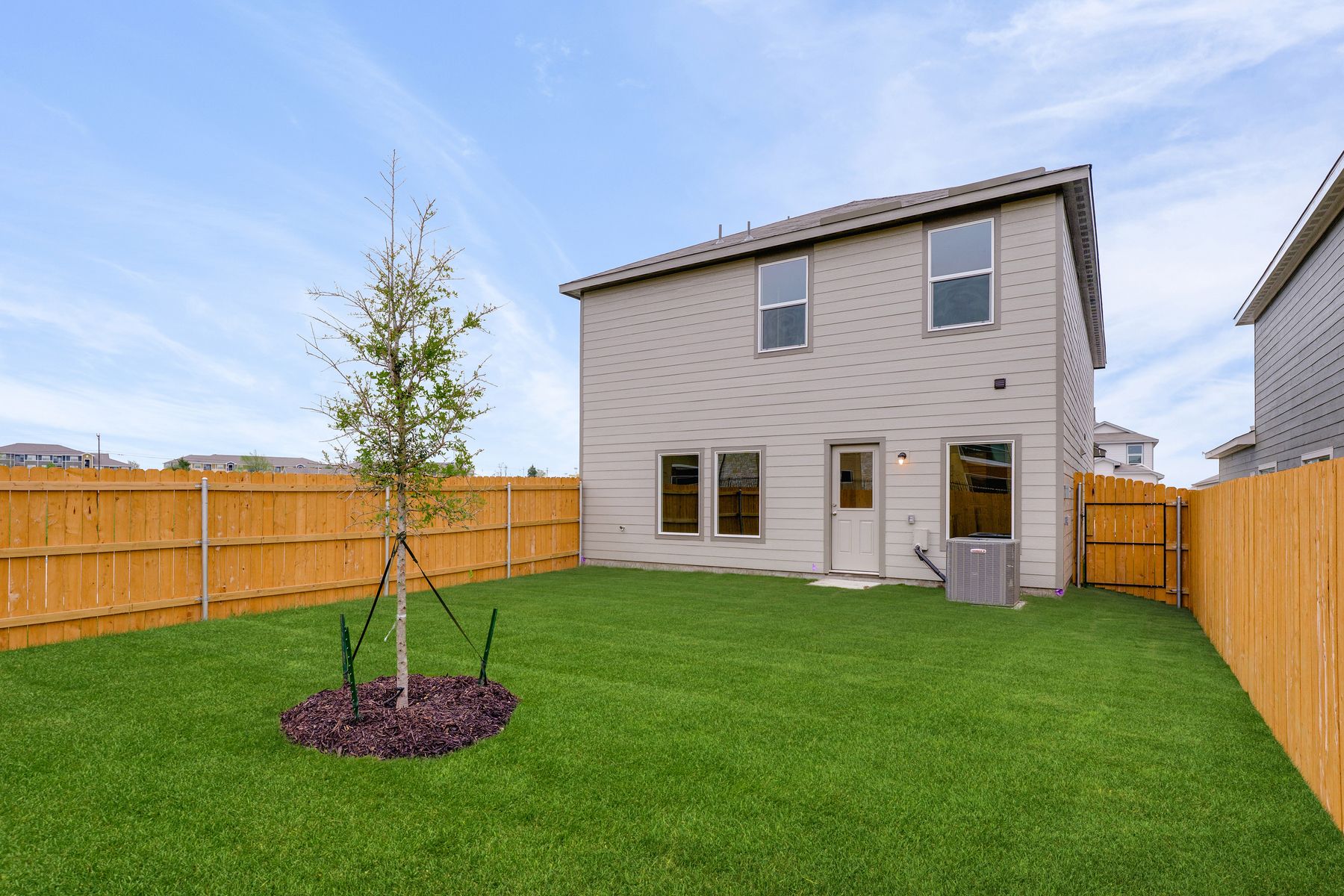 The back yard of the Yaupon is fully fenced-in.