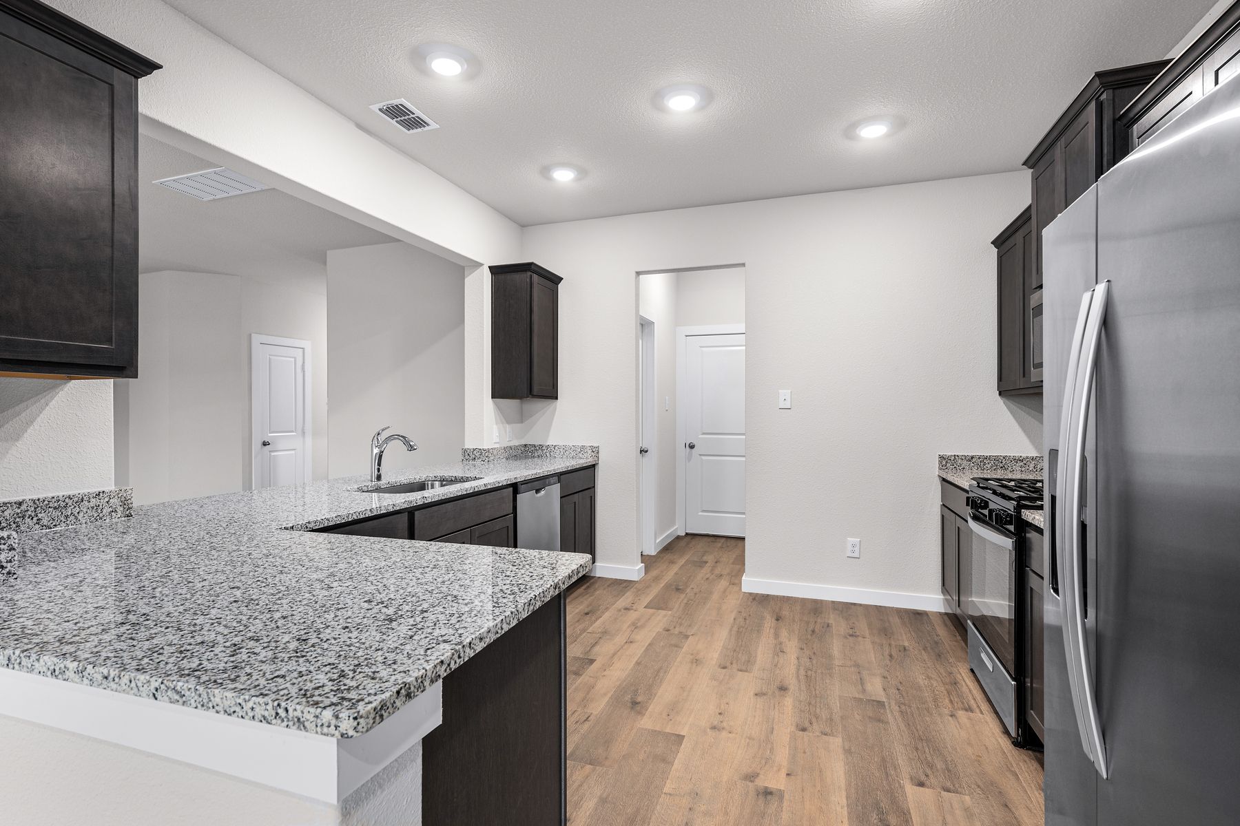 The kitchen has plenty of counterspace to make the cooking and cleaning process easier than ever.