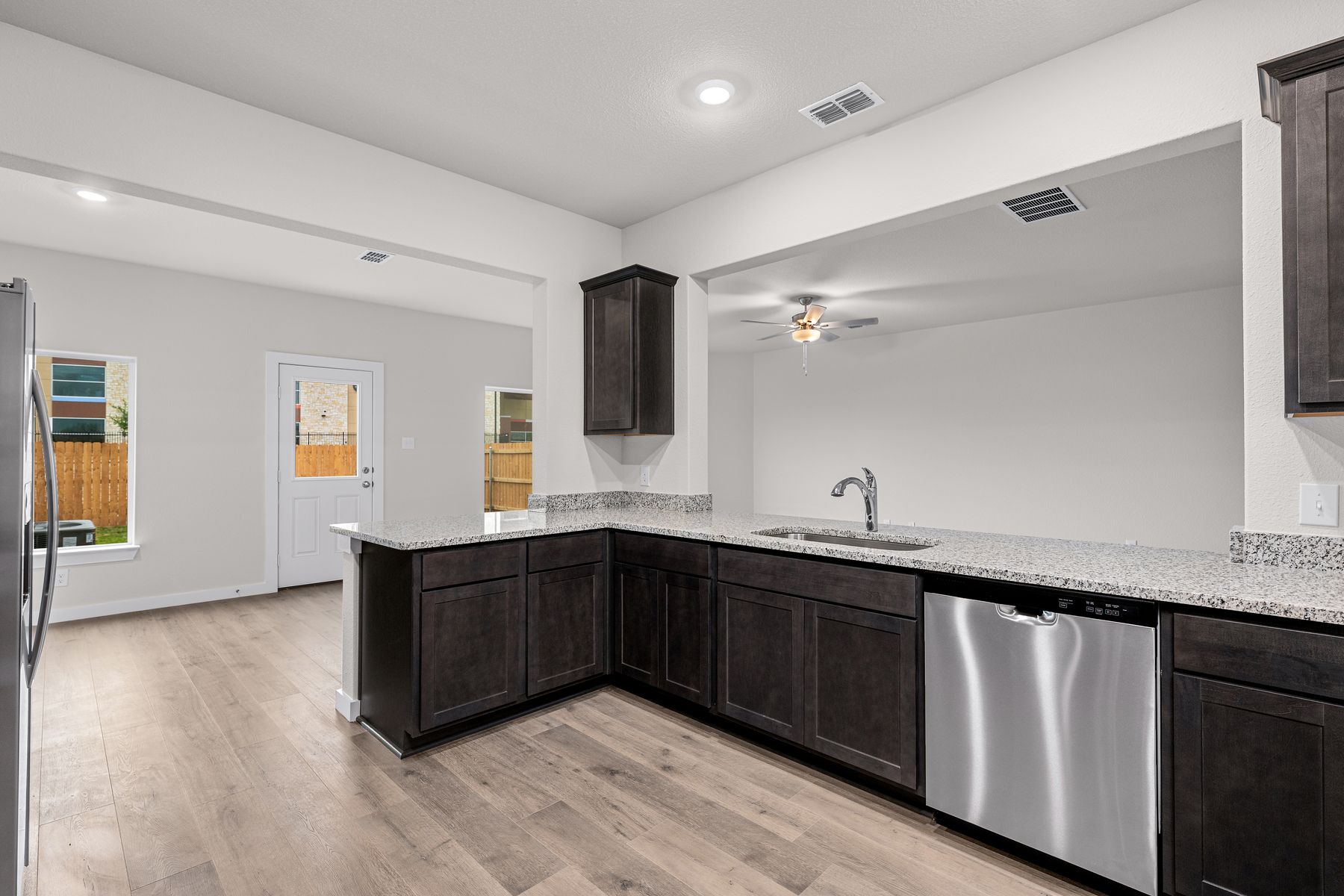 The dining room and living room both sit right off of the kitchen.
