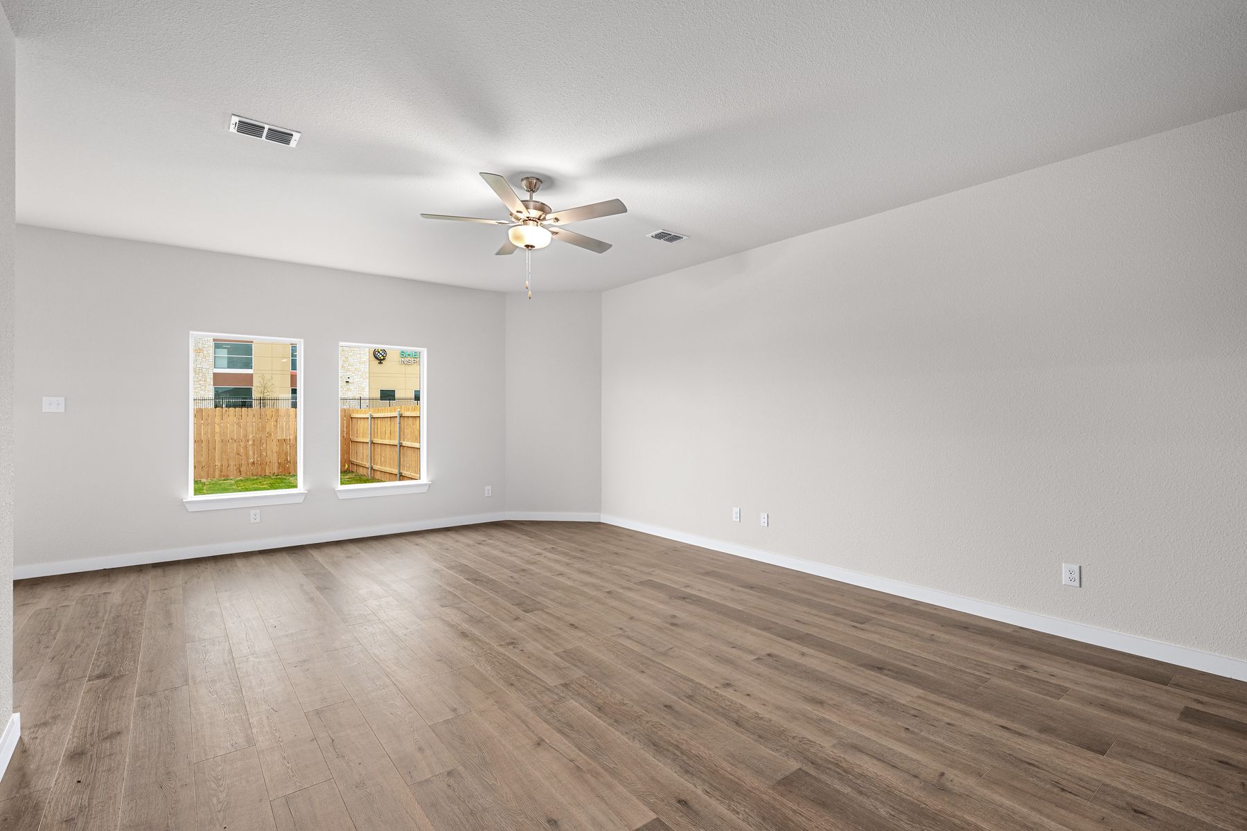 The family room has two large windows that let in great, natural light.