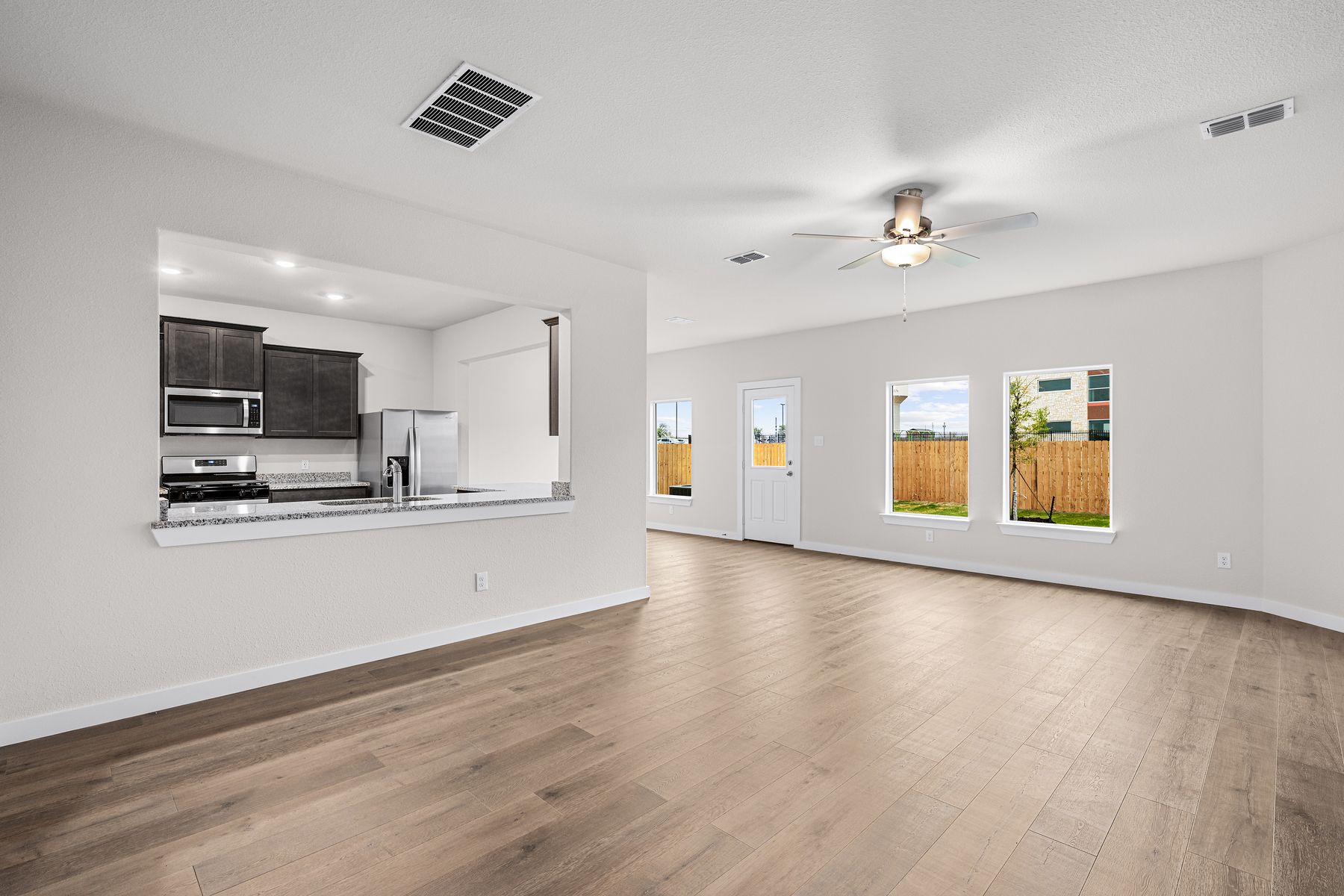 The family room is spacious and has plenty of room for furniture.
