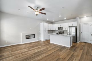 The family room is spacious with an electric fireplace.