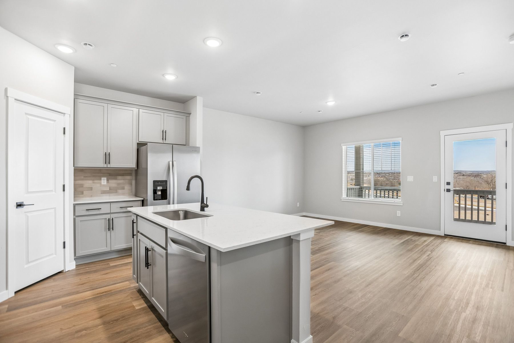 The family room is spacious and off of the kitchen.
