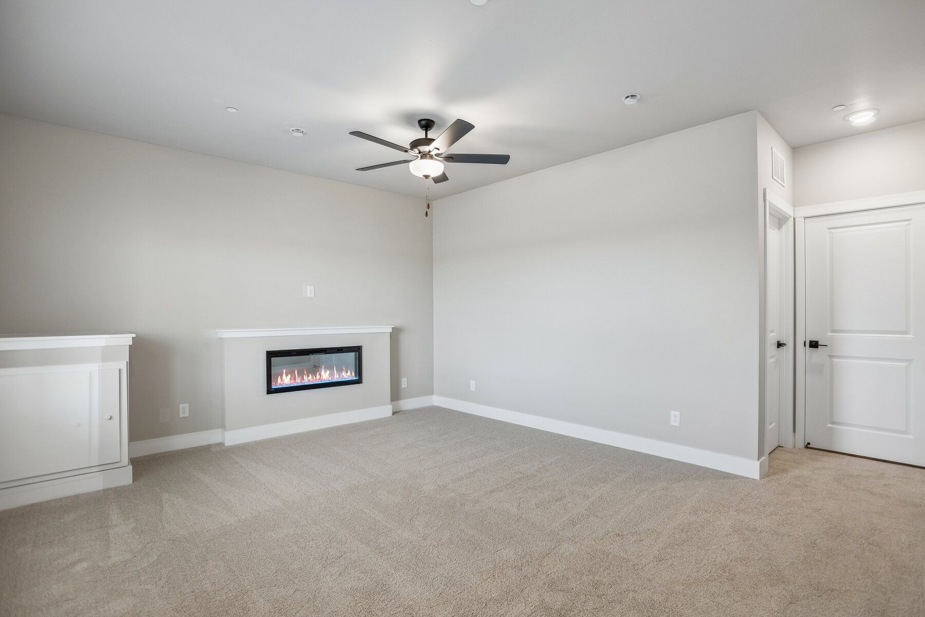There is an additional living room on the first floor with an electric fireplace.