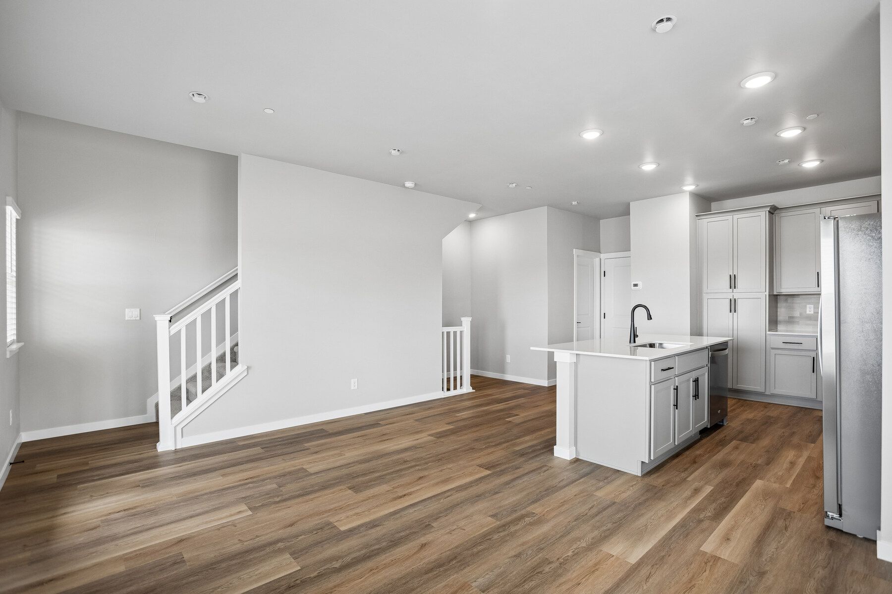 The family room is spacious and off of the kitchen.